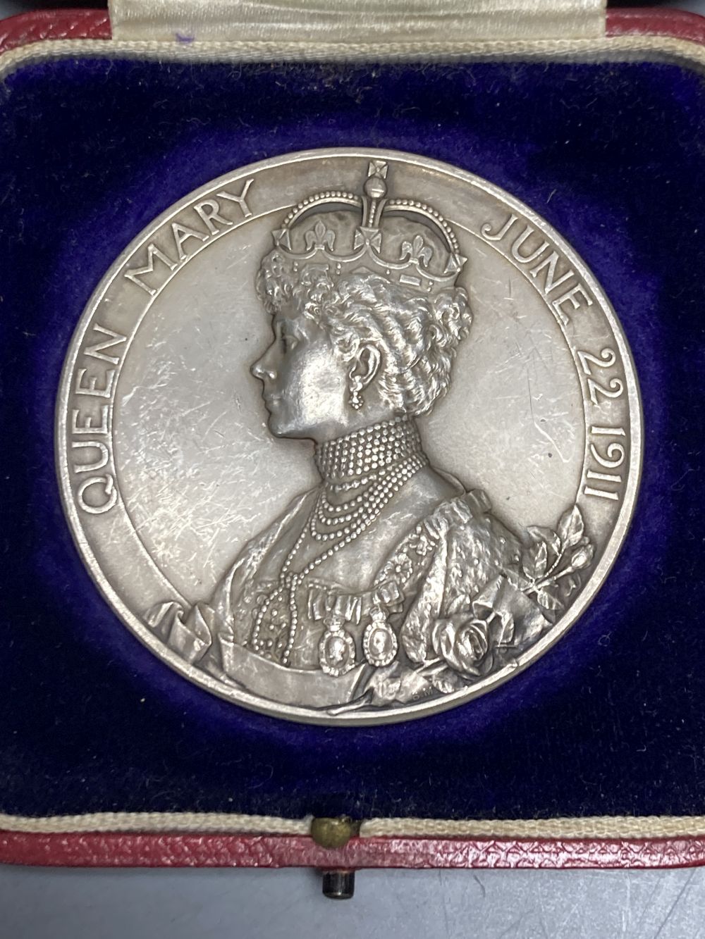 A cased George V silver coronation medal, 1911, by B. Mackennal, 51mm, 85g, GVF